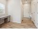 Office nook with a built-in desk, light wood flooring, and natural light from a window at 3831 E 141St Ave, Thornton, CO 80602