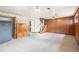 Finished basement featuring classic wood paneling and carpet at 1010 Kennedy Dr, Westminster, CO 80234