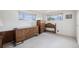 Spacious bedroom featuring vintage wooden furniture and ample natural light at 1010 Kennedy Dr, Westminster, CO 80234
