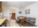 Cozy kitchen nook featuring plaid cushions and view into adjacent dining room at 1010 Kennedy Dr, Westminster, CO 80234
