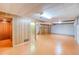 Spacious basement featuring a large area with finished flooring and bright lights, ideal for various activities at 1669 S Kearney St, Denver, CO 80224