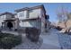 Multi-level home featuring modern architecture and stone accents at 6722 S Winnipeg Cir # 102, Aurora, CO 80016