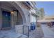 Charming front entrance with brick archway and landscaped walkway at 6722 S Winnipeg Cir # 102, Aurora, CO 80016