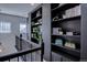 Upper hallway with custom built-in shelving perfect for books or displaying decor at 6722 S Winnipeg Cir # 102, Aurora, CO 80016