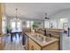 Bright, open kitchen and dining area with stainless steel appliances and plenty of natural light at 6722 S Winnipeg Cir # 102, Aurora, CO 80016