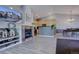 Open-concept living area with fireplace, dining space, and modern kitchen at 6722 S Winnipeg Cir # 102, Aurora, CO 80016