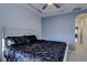 Comfortable main bedroom with a king-size bed and view of the hallway at 6722 S Winnipeg Cir # 102, Aurora, CO 80016