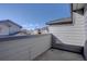 An empty fenced in concrete patio in need of an update at 6722 S Winnipeg Cir # 102, Aurora, CO 80016