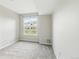 Bedroom with plush carpeting and a window overlooking the community at 7440 S Blackhawk St # 2-203, Englewood, CO 80112