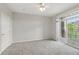 Bedroom with a ceiling fan and sliding glass doors to a balcony at 7440 S Blackhawk St # 2-203, Englewood, CO 80112