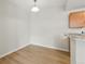 This dining area has light colored floors with a modern light fixture at 7440 S Blackhawk St # 2-203, Englewood, CO 80112