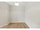 Empty dining room with light colored flooring and a simple light fixture at 7440 S Blackhawk St # 2-203, Englewood, CO 80112