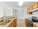 Kitchen featuring stainless steel appliances, granite countertops and wooden cabinets at 7440 S Blackhawk St # 2-203, Englewood, CO 80112