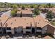 A captivating aerial view showcasing the complex, mature trees, walkways and parking at 12053 E Harvard Ave # 107, Aurora, CO 80014