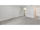 A clean carpeted bedroom with a closet, providing a blank canvas for personal touches at 12053 E Harvard Ave # 107, Aurora, CO 80014