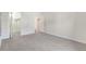 A spacious, carpeted bedroom with a closet, illuminated by natural light, awaits your personal touch at 12053 E Harvard Ave # 107, Aurora, CO 80014