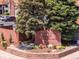 Well-maintained Telegraph Hill II Condominiums entrance with mature landscaping and signage at 12053 E Harvard Ave # 107, Aurora, CO 80014