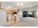 Inviting living space with open layout, stone fireplace and access to outdoor patio at 12053 E Harvard Ave # 107, Aurora, CO 80014
