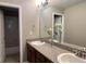 Bathroom featuring granite countertops, double sinks, and decorative accents at 12627 Fisher Dr, Englewood, CO 80112