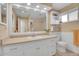 Bright bathroom with double vanity, and large mirror at 12821 W 60Th Ave, Arvada, CO 80004