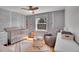 Charming Bedroom features whimsical tree mural and cozy seating area at 12821 W 60Th Ave, Arvada, CO 80004