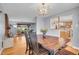 Open-concept dining room connects to the living room and kitchen for seamless entertaining at 12821 W 60Th Ave, Arvada, CO 80004