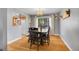 Dining room featuring a dark wood table and chairs with an attractive light fixture at 12821 W 60Th Ave, Arvada, CO 80004