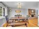 Bright dining room featuring stylish light fixture and decor at 12821 W 60Th Ave, Arvada, CO 80004
