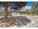 View of the home's front yard, showcasing its well-maintained landscaping and brick facade at 12821 W 60Th Ave, Arvada, CO 80004