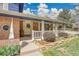 Inviting front porch with decorative railing and landscaping providing curb appeal at 12821 W 60Th Ave, Arvada, CO 80004