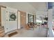 Comfortable seating area on a covered front porch, perfect for relaxing outdoors at 12821 W 60Th Ave, Arvada, CO 80004