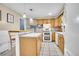Bright kitchen features ample cabinets and modern appliances at 12821 W 60Th Ave, Arvada, CO 80004