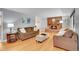 Bright living area with hardwood floors, brick fireplace, and plenty of natural light at 12821 W 60Th Ave, Arvada, CO 80004