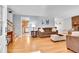 Spacious living room featuring hardwood floors, a cozy fireplace, and neutral wall colors at 12821 W 60Th Ave, Arvada, CO 80004