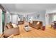 Bright living room boasts hardwood floors, modern furniture, and easy access to stairs at 12821 W 60Th Ave, Arvada, CO 80004