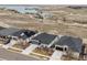 A high angle view shows an upscale neighborhood and peaceful lake, perfect for a relaxing lifestyle at 26741 E Peakview Pl, Aurora, CO 80016