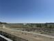 Serene backyard view of a lake and walking trail, offering a tranquil escape at 26741 E Peakview Pl, Aurora, CO 80016