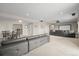 Basement showcasing an open layout with a seating area, dining space, and a home theater setup at 26741 E Peakview Pl, Aurora, CO 80016