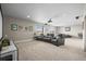 Spacious basement with plush carpet, home theater seating, and plenty of room for entertainment at 26741 E Peakview Pl, Aurora, CO 80016