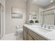 Bathroom featuring a single sink vanity with marble countertop and a glass enclosed shower at 26741 E Peakview Pl, Aurora, CO 80016