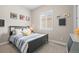 Cozy bedroom decorated with sports-themed decor and a comfortable bed, ideal for a  at 26741 E Peakview Pl, Aurora, CO 80016