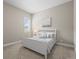 Cozy bedroom with neutral tones, plush carpet, and a window offering natural light at 26741 E Peakview Pl, Aurora, CO 80016