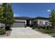 Charming ranch style home featuring a two-car garage, landscaped yard, and an inviting entrance at 26741 E Peakview Pl, Aurora, CO 80016