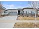 Charming single-story home with neutral exterior, well-maintained lawn, and attached two-car garage at 26741 E Peakview Pl, Aurora, CO 80016