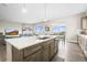 Open-concept kitchen with island, stainless steel appliances, and great views at 26741 E Peakview Pl, Aurora, CO 80016