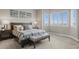 Bedroom featuring a comfortable bed, natural light, and tranquil ambiance at 26741 E Peakview Pl, Aurora, CO 80016