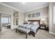 Relaxing main bedroom with soft lighting and a glimpse into the main bathroom at 26741 E Peakview Pl, Aurora, CO 80016