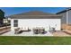 Backyard patio with comfortable seating and a table, perfect for outdoor relaxation at 7222 Aspen Brook Ave, Frederick, CO 80530