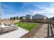 Landscaped backyard with grass and patio area perfect for outdoor entertaining at 7222 Aspen Brook Ave, Frederick, CO 80530