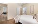 This bedroom features plush carpeting, large window, and neutral decor for a calming ambiance at 7222 Aspen Brook Ave, Frederick, CO 80530